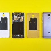 Dismantled Smartphone on Yellow Surface