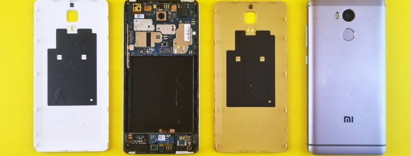 Dismantled Smartphone on Yellow Surface
